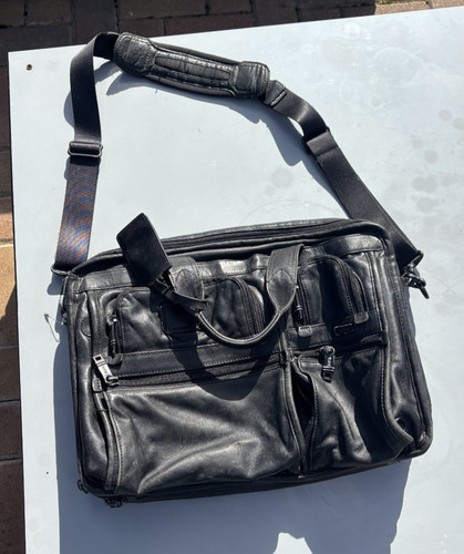 Black leather tumi - leather,
